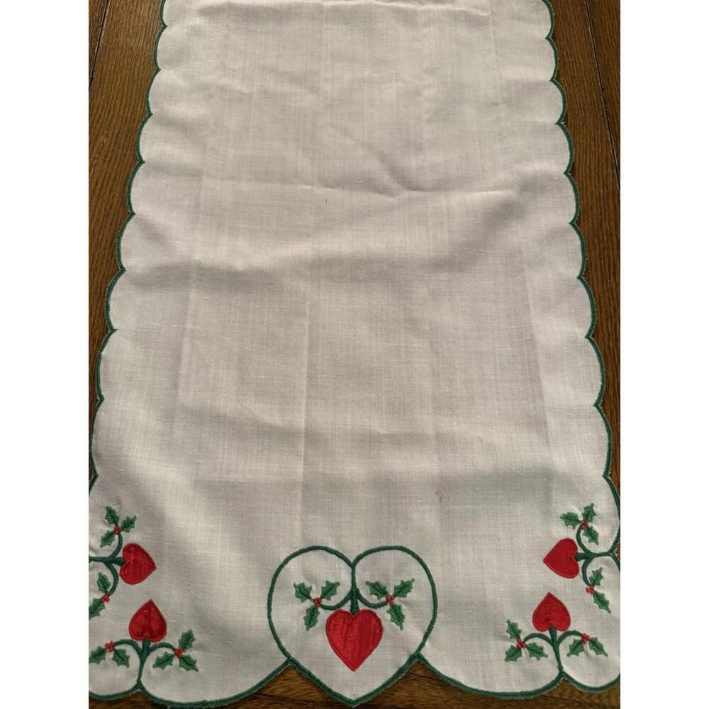 Table runner appliqued with red hearts and embroidered holly leaves 88” X 13.5”